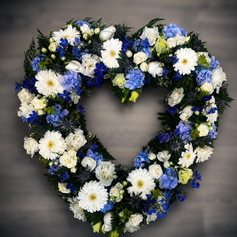 Blue and white open heart funeral tribute, Eastbourne