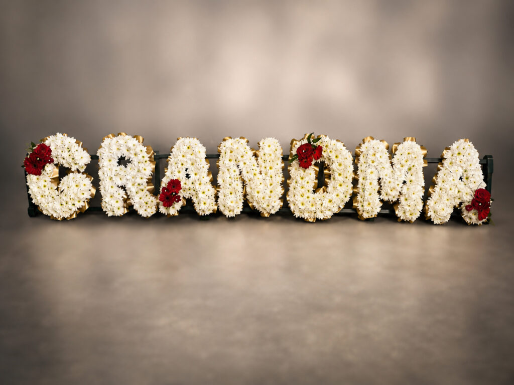 Fresh flower lettering funeral tribute spelling Grandma, Eastbourne florist