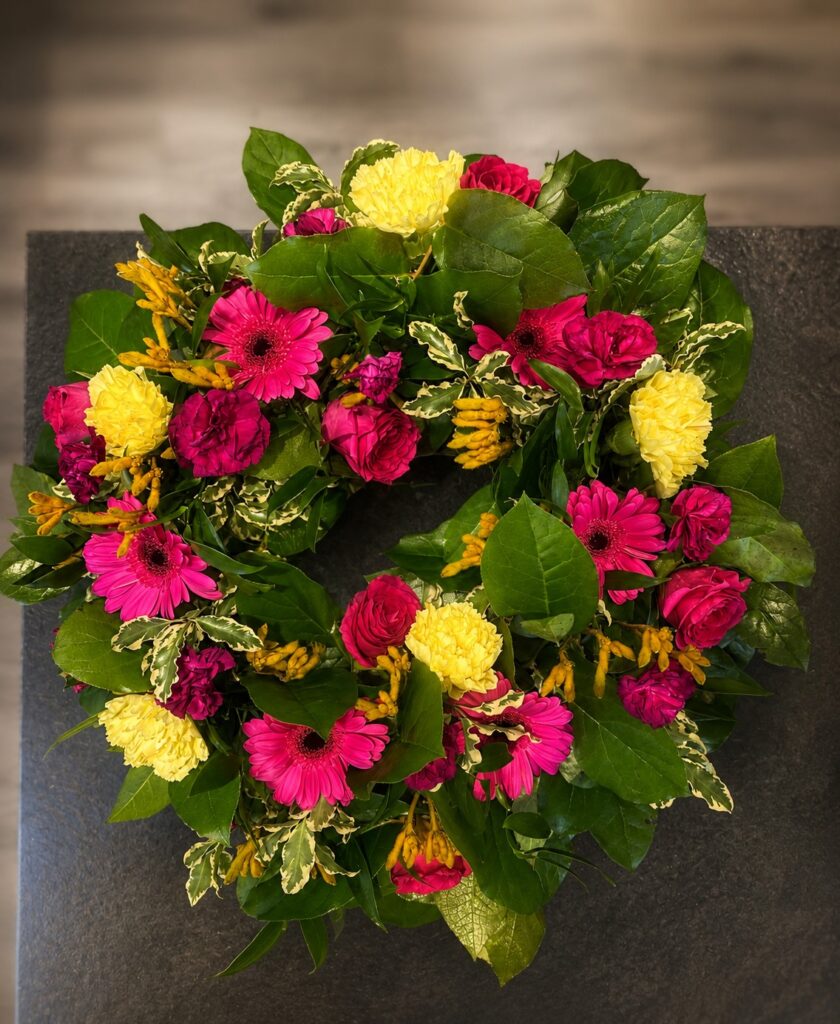 Colourful fresh flower funeral wreath, Eastbourne